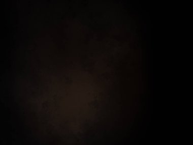 Ortasında beyaz ışık olan siyah bir arkaplan.