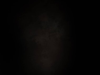 Ortasında beyaz ışık olan siyah bir arkaplan.