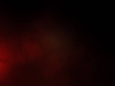 Karanlıkta siyah arka planı olan kırmızı bir ışık.