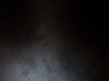 Siyah bir arka planın önünde duran takım elbiseli ve kravatlı bir adam.