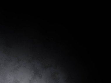 Siyah bir arka planın önünde duran takım elbiseli ve kravatlı bir adam.