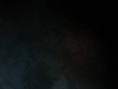 Siyah bir arka planın önünde duran takım elbiseli ve kravatlı bir adam.