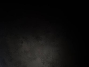 Siyah bir arka planın önünde duran takım elbiseli ve kravatlı bir adam.