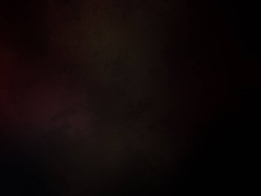 Karanlıkta siyah arka planı olan kırmızı bir ışık.