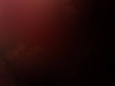 Kırmızı arka planda duran takım elbiseli ve kravatlı bir adam.