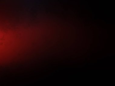 Karanlıkta siyah arka planı olan kırmızı bir ışık.