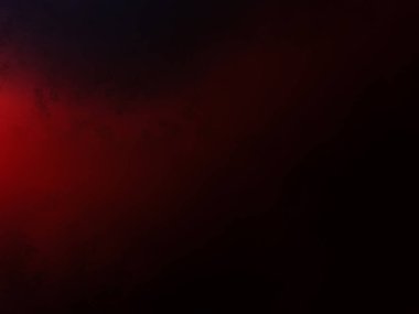 Karanlıkta siyah arka planı olan kırmızı bir ışık.