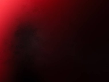 Kırmızı kravat takan takım elbiseli bir adam.