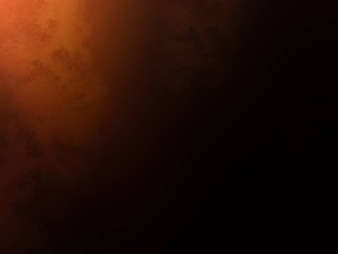 Elinde cep telefonu olan takım elbiseli ve kravatlı bir adam.