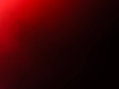 Siyah bir arkaplanda parlayan kırmızı bir ışık.