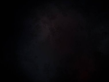 Ortasında kırmızı ışık olan siyah bir arkaplan