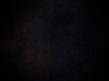 Ortasında kırmızı ışık olan siyah bir arkaplan