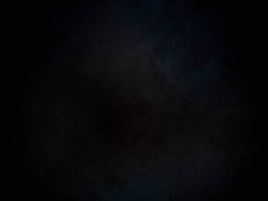 Merkezinde kırmızı nokta olan siyah bir arkaplan.