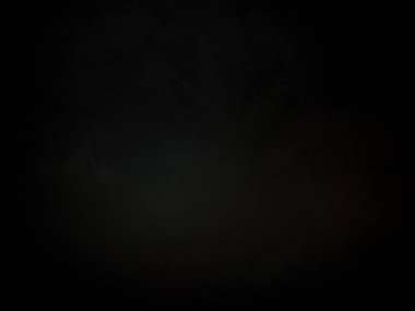 Ortasında ışık olan siyah bir arkaplan