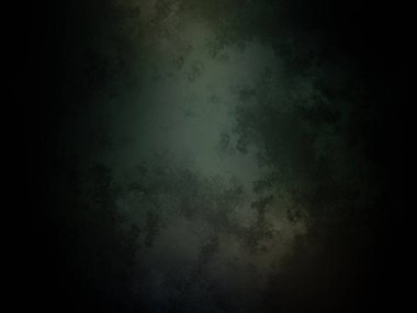 Koyu yeşil arkaplan ve üstten gelen bir ışık.