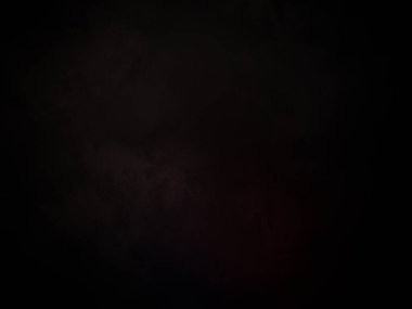 Ortasında kırmızı ışık olan siyah bir arkaplan