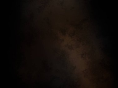 Siyah bir arka planın önünde duran takım elbiseli ve kravatlı bir adam.