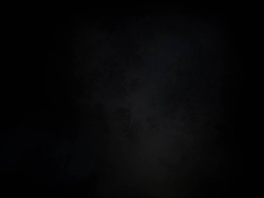 Ortasında beyaz ışık olan siyah bir arkaplan.