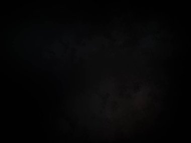 Ortasında beyaz ışık olan siyah bir arkaplan.