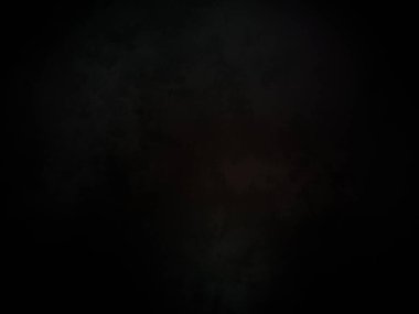 Ortasında kırmızı ışık olan siyah bir arkaplan