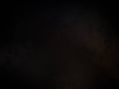 Karanlık bir yüzeyde kaykay süren bir insan.