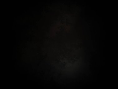 Ortasında kırmızı ışık olan siyah bir arkaplan