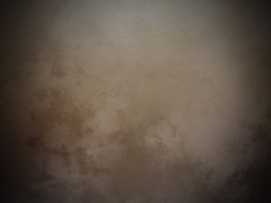 Üzerinde saat olan kahverengi bir duvar.