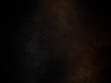 Koyu turuncu ve sarı ışıklı siyah bir arkaplan.