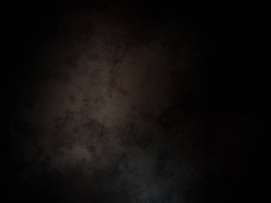 Ortada siyah bir nokta olan siyah bir arkaplan.