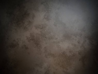 Koyu kahverengi bir duvar ve beyaz bir nokta.