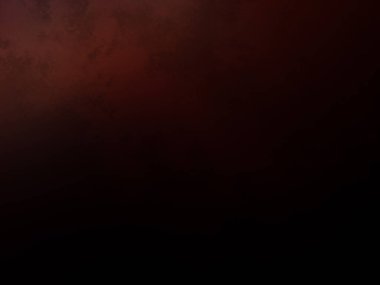 Elinde cep telefonu olan takım elbiseli ve kravatlı bir adam.