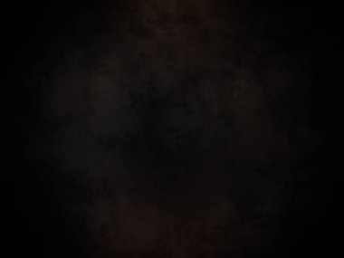 Siyah bir arka plan ve koyu bir duman çemberi.