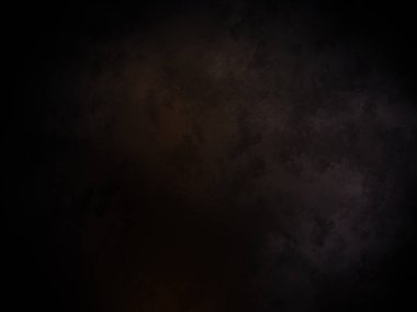 Koyu turuncu ve sarı ışıklı siyah bir arkaplan.