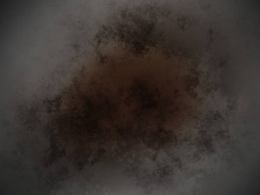 Beyaz arka planda siyah ve kahverengi bir madde.