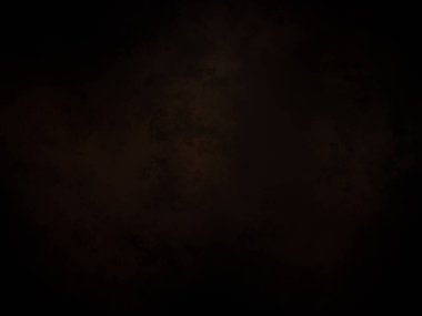 Siyah bir arka planın önünde duran takım elbiseli ve kravatlı bir adam.