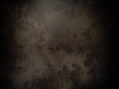 Ortasında siyah bir nokta olan koyu bir arkaplan.