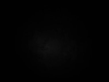 Ortasında beyaz ışık olan siyah bir arkaplan.