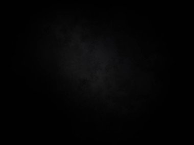 Ortasında beyaz ışık olan siyah bir arkaplan.