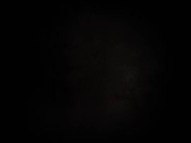 Ortasında beyaz ışık olan siyah bir arkaplan.