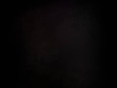 Ortasında kırmızı ışık olan siyah bir arkaplan