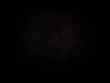 Ortasında kırmızı ışık olan siyah bir arkaplan