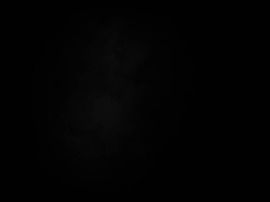 Ortasında beyaz ışık olan siyah bir arkaplan.