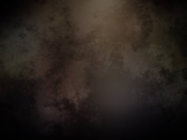 Karanlık bir arka plan, tepesinde bir ışık parlıyor.