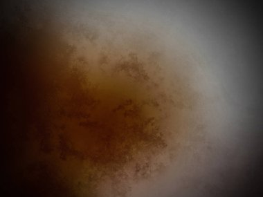 Siyah arkaplanı olan kahverengi bir madde.