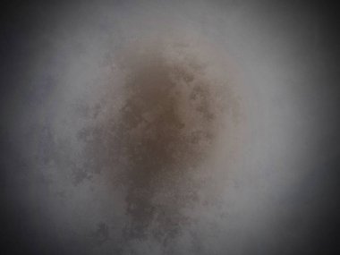 Kahverengi bir maddenin siyah beyaz fotoğrafı.