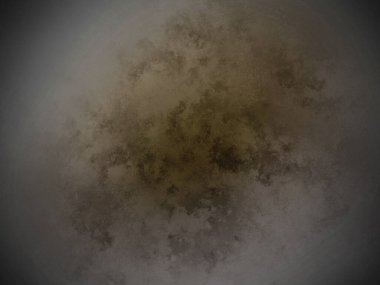 Siyah arkaplanı olan kahverengi bir madde.