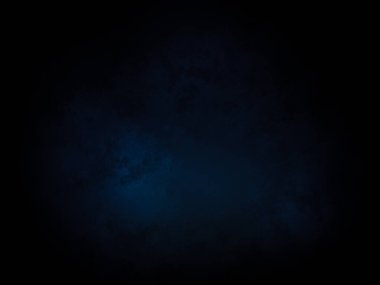 Ortasında ışık olan koyu mavi bir arkaplan.