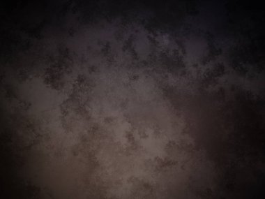 Siyah arkaplanı olan koyu renkli bir duvar.