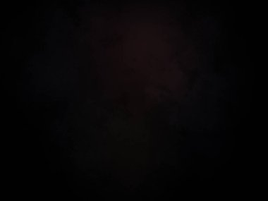 Karanlıkta siyah arka planı olan kırmızı bir ışık.