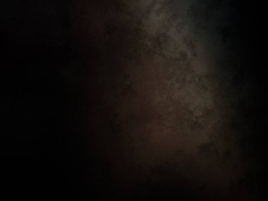 Siyah bir arka planın önünde duran takım elbiseli ve kravatlı bir adam.